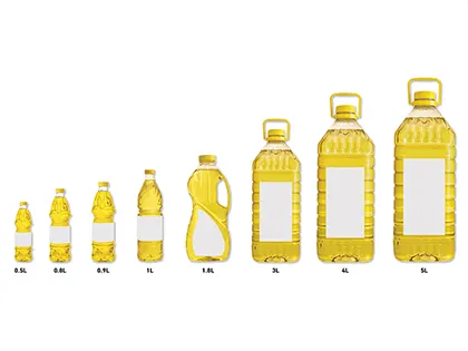 Розливання соняшникової олії у різні пляшки