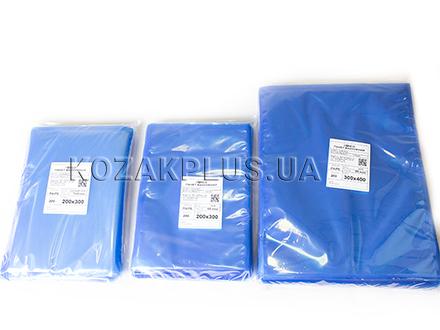 Різні розміри синіх пакетів